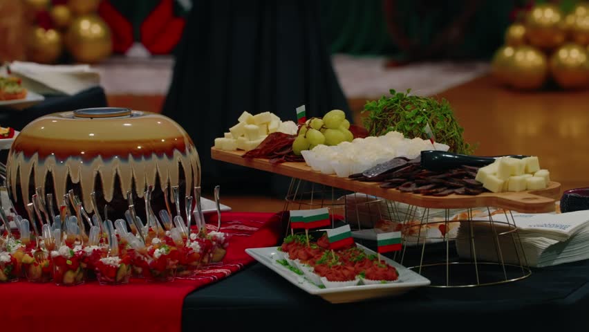 Traditional Balkan Bulgarian food spread featuring cured meats and cheese at a Des Plaines festival.