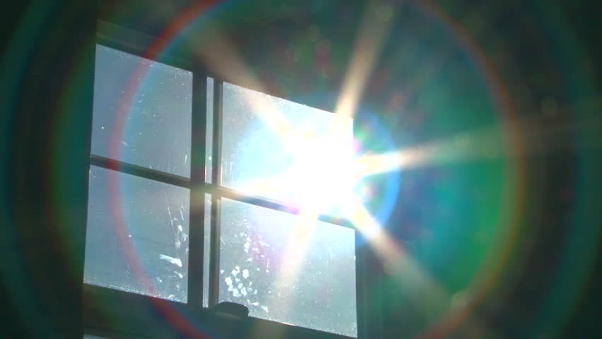 Sun shines bright through window, zoom in with science fiction warp effect.