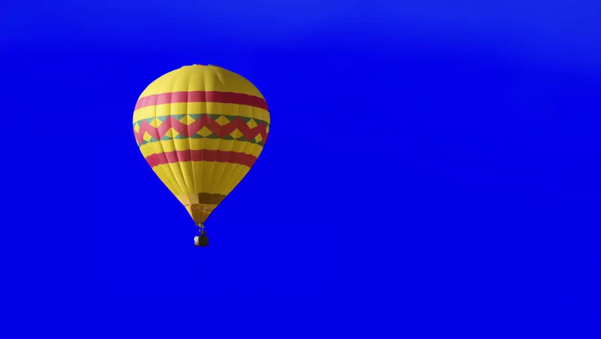 Hot air balloon floating isolated on blue background 