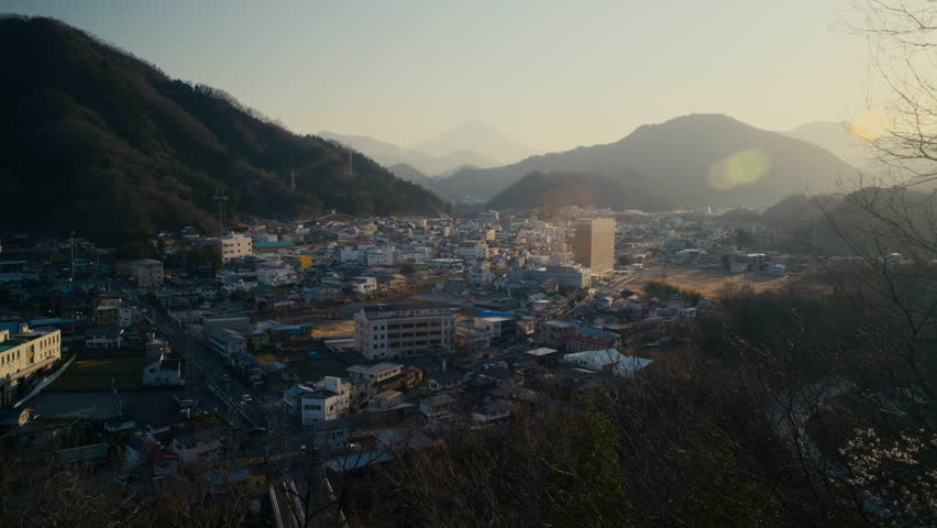 Mount Fuji landscape seen between buildings in Otsuki city Japan.