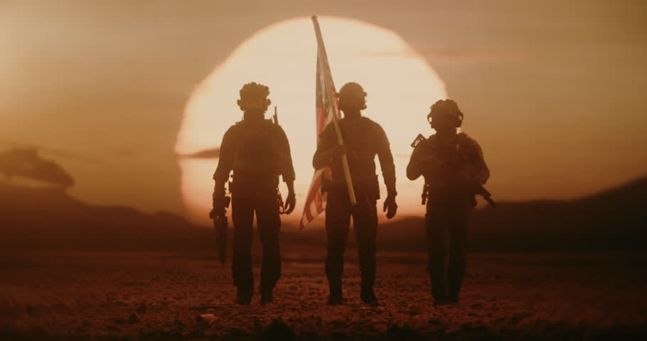 Silhouette of Three Soldiers walk Through a Desert at Sunset Carrying United States Flag, Military Helicopter Flies in Background. Patriotic Valor, Freedom Fighting, Peace Mission, Warfare, Conflict.