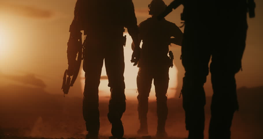 Three Male Soldiers in Advanced Combat Gear March Across a Desert Warzone, Silhouette by a Massive Air Force Formation of Helicopters. Patrol With Rifles, Helmets, Modern Military Battlefield