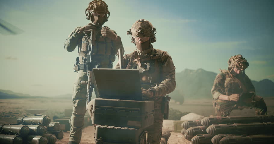 Special Forces Soldiers Deploy Reconnaissance and Surveillance Systems at a Desert Base, Operating Field Laptop, Providing Tracking and Air Strike Analysis for Helicopter Battlefield Coordination