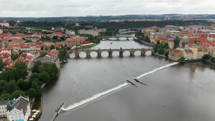 Prague Old Town in Czech Republic with Famous Sightseeing Places in Background. Charles Bridge Iconic 14th century Structure with View, Vltava river and Prague Cityscape. Must Visit City. Drone
