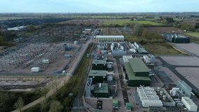 Industrial drone perspective of the Walpole energy hub, emphasizing the complex layout of the 400kV switchyard and grid integration assets. - Powered by Shutterstock - Get 15% off with code: PIKWIZARD15