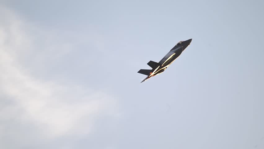 The F-35A Lightning II variant performs high-performance air maneuvers.