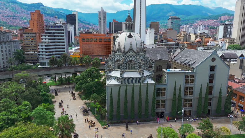 Drone view of the old Antioquia Railway Station building in Medellin, Colombia, capturing its historic architecture, urban setting, and cultural landmark presence from above.