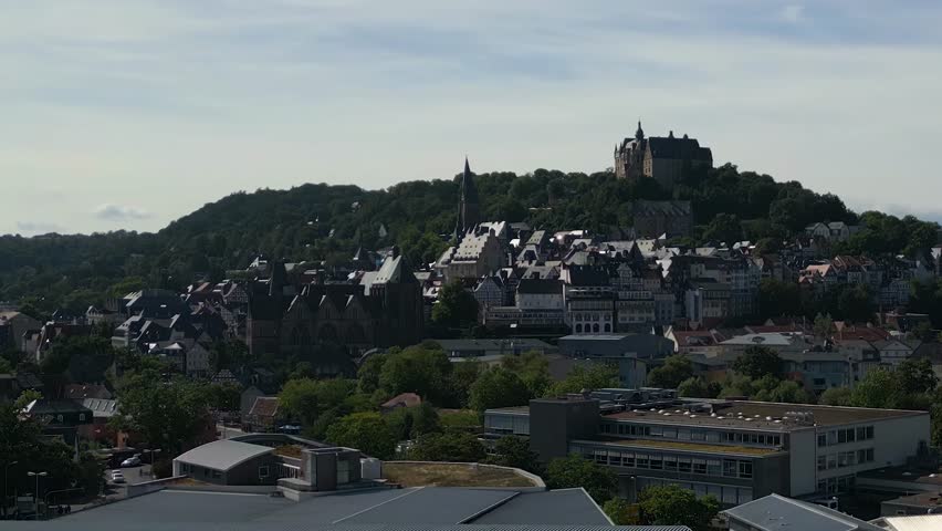 Aerial panorama view beside the old town of the city Marburg in Germany Hesse on a sunny afternoon in summer.