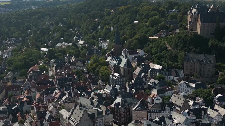 Aerial panorama view beside the old town of the city Marburg in Germany Hesse on a sunny afternoon in summer.