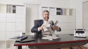 Man throwing cash in slow motion business concept. Flying money rain around professional businessman. Office scene with excited man throwing money. Slow motion cash rain. Business success. - Powered by Shutterstock - Get 15% off with code: PIKWIZARD15