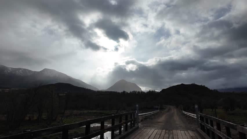 Open Road in the Chilean Patagonia with Fenced Fields