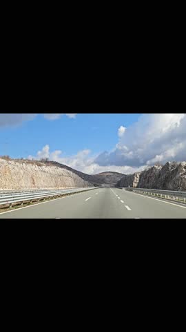 Straight Road Through Mountain Landscape