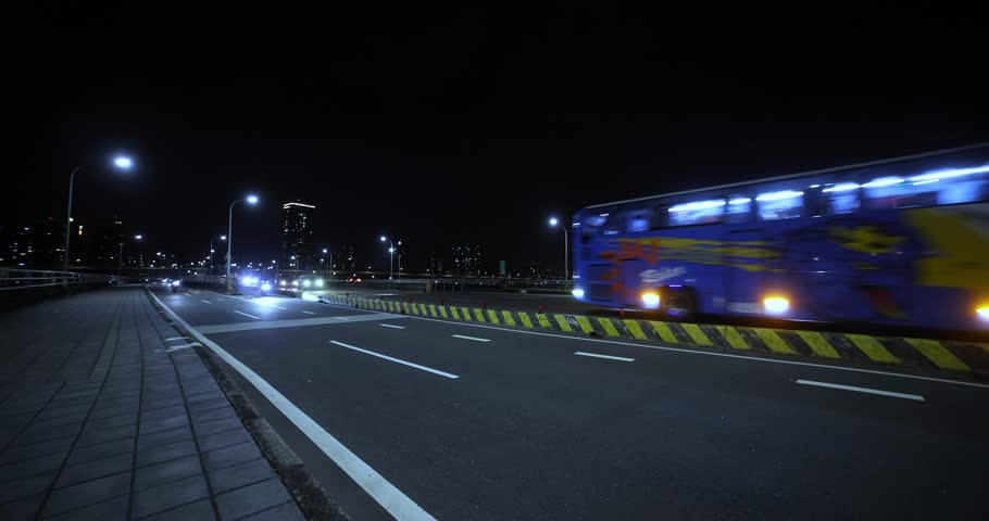 A night cityscape of traffic jam near Taipei bridge wide shot