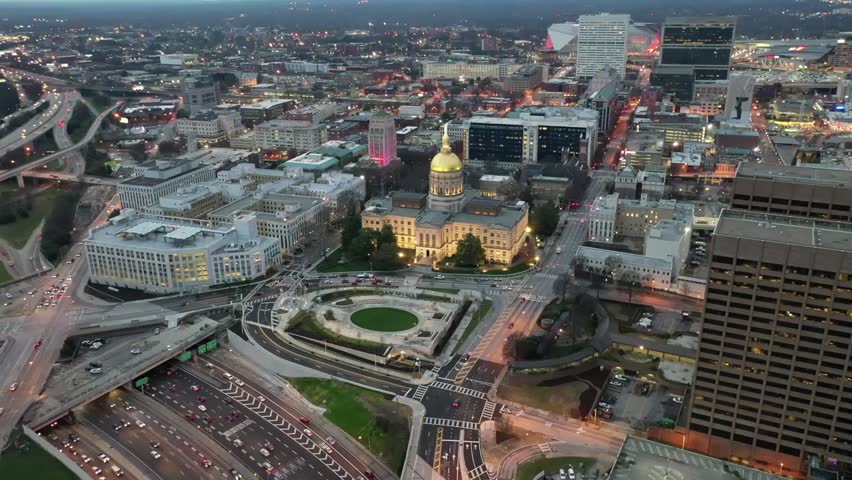 Aerial view of the Georgia State Capitol building in downtown Atlanta with its iconic gold dome, highlighting government architecture and the city skyline.