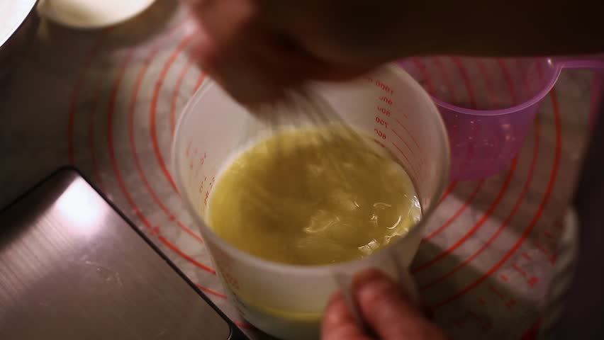 Video of cake batter being mixed and prepared for baking