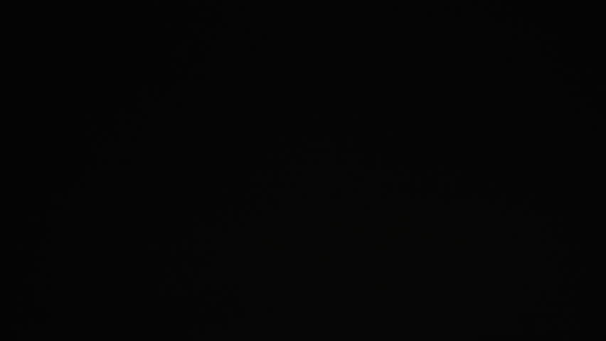 a lightning electric storm lights up a dark nighttime sky