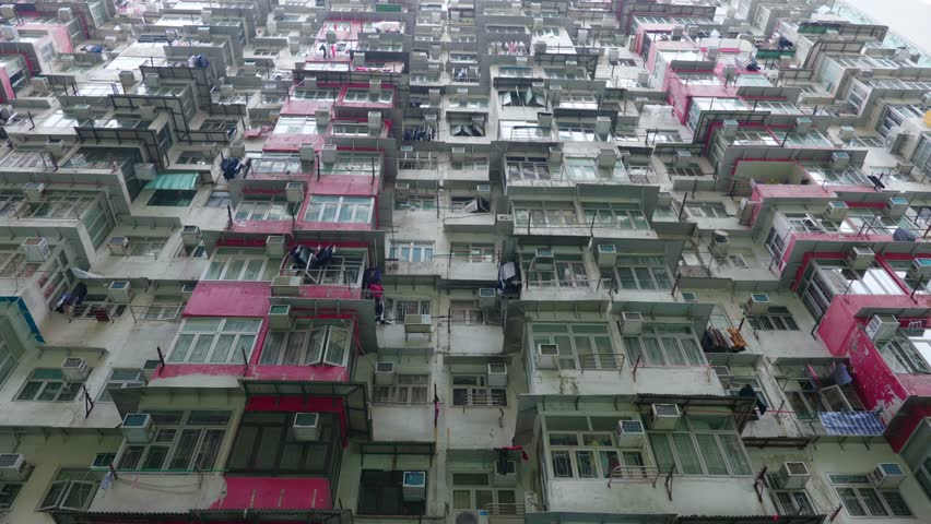 Panoramic urban view of the apartment towers at Yick Cheong Building, also known as the Monster Building, in Hong Kong on a sunny day.