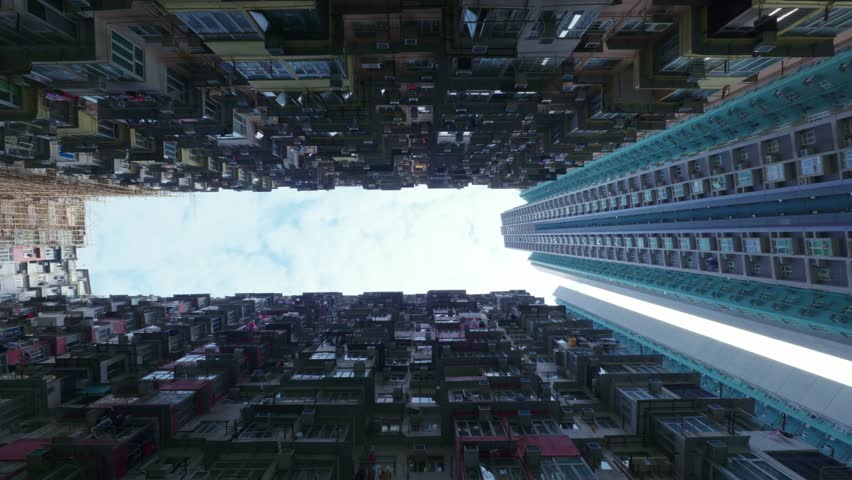 Panoramic urban view of the apartment towers at Yick Cheong Building, also known as the Monster Building, in Hong Kong on a sunny day.
