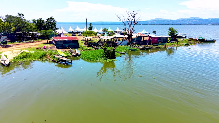 Cinematic bird’s-eye view capturing the breathtaking horizon and tranquil environment of lake Victoria shared by Kenya, Uganda, and Tanzania. lake Victoria water lake