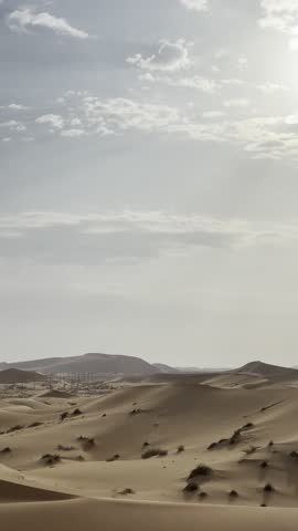 Sand dunes with sky and clouds
