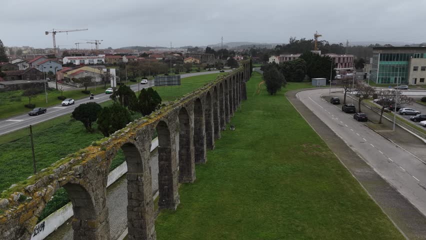 Drone shot of 17th century water aqueduct with archs in Portugal. Vila do Conde city.