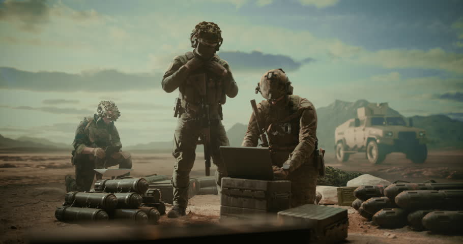 Special Forces Soldiers on Desert Command Post, Using Laptop to Monitor Targets, Reconnaissance, Precision Strike Support Beside Munitions, Helicopters, Tactical Vehicles in Middle East Combat Zone