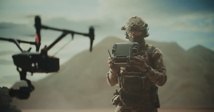 Special Forces Drone Operator Hovers a Tactical Quadcopter Drone at a Desert Base, Battlefield Mapping, Precision Strike, Target Tracking,Reconnaissance With a Control Station Modern Warfare War