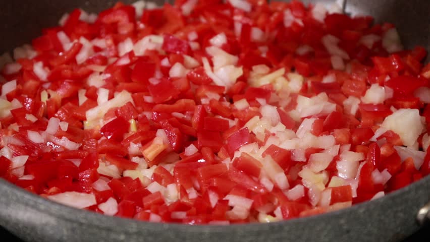 Sauteing Onion and Red Bell Peppers in Pan Cooking