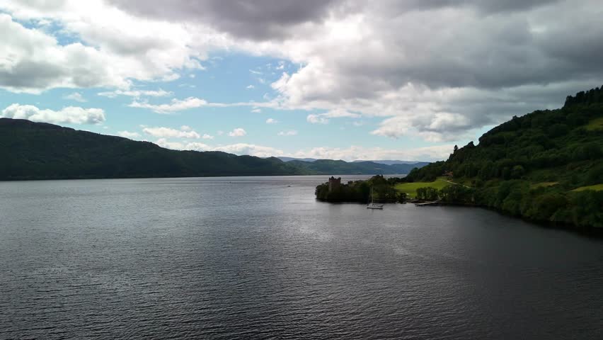 Cinematic Aerial View of Urquhart Castle Ruins on the Banks of Loch Ness, Scotland Highlands