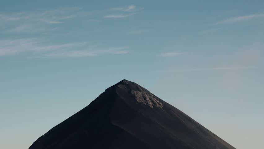 Smoke plume drifting from active Fuego volcano crater
