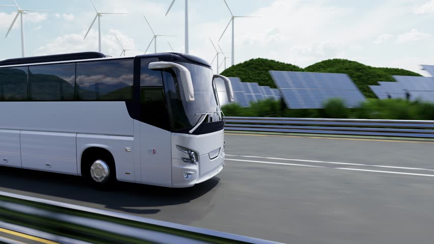 electric coach bus driving on highway with wind turbines and solar panels 