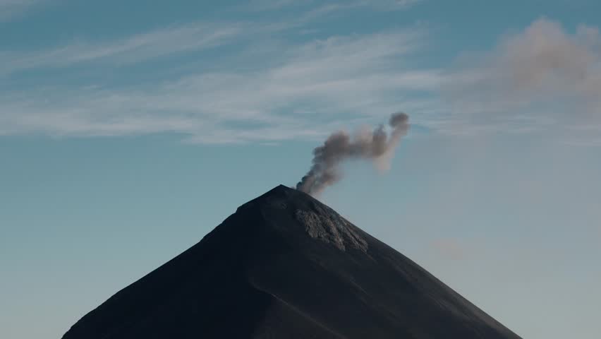 Smoke plume rising from Fuego volcano crater Guatemala