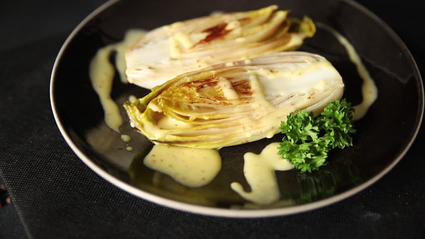 Chicory dish roasted or stewed vegetable preparation tasty snack fresh gourmet food background on the table rustic food top view copy space keto and paleo diet vegetarian and vegan food 