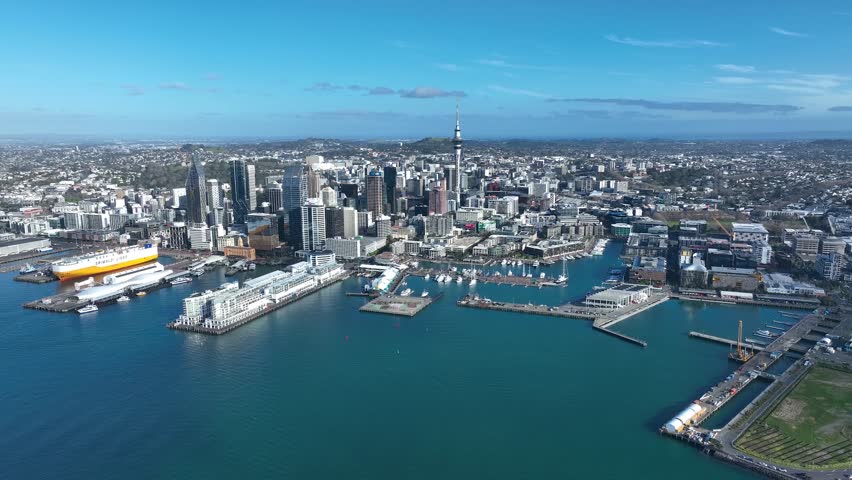 Auckland - Wide Panoramic Flight Over Auckland and Auckland Bay, New Zealand. Skyline. New Skyscrapers. City Canyon. Aerial Pedestal in Establishing Drone Shot.