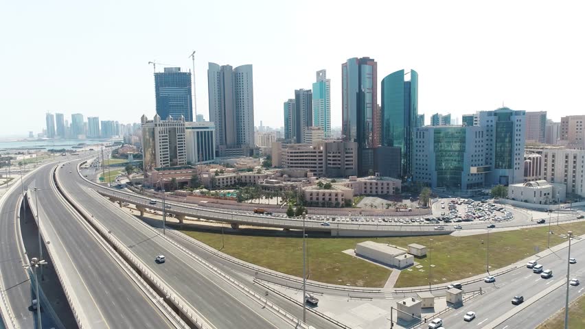 Aerial drone view of Manama skyline and Bahrain financial district featuring modern skyscrapers, urban buildings and coastal waterfront. Capital of Bahrain in the Middle East with a vibrant skyline and contemporary architecture.