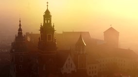 Aerial view of Wawel Castle during foggy sunrise, Krakow, Poland - Powered by Shutterstock - Get 15% off with code: PIKWIZARD15