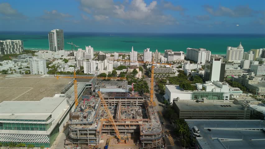Miami Beach aerial construction site with Atlantic Ocean and palm avenue