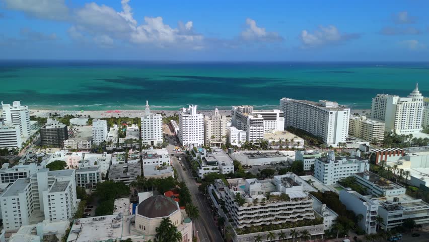 Miami Beach aerial coastline with oceanfront hotels and sandy shoreline