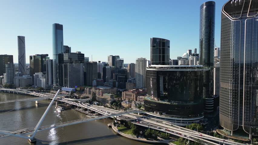 Scenic aerial cityscape of Brisbane Australia showing financial district skyscrapers along the riverbank, contemporary urban travel destination