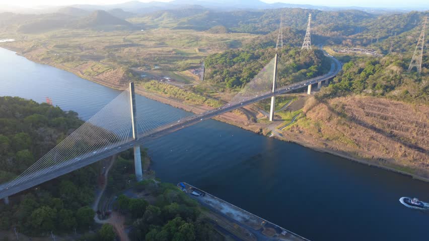 Centennial Bridge spans the Panama Canal, a vital waterway connecting oceans and global commerce.

Landscape of the Centennial Bridge crossing the Panama Canal with dense tropical forests stretching across the hills of Panama. The peaceful morning atmosphere contrasts with the immense scale of the canal infrastructure. 
