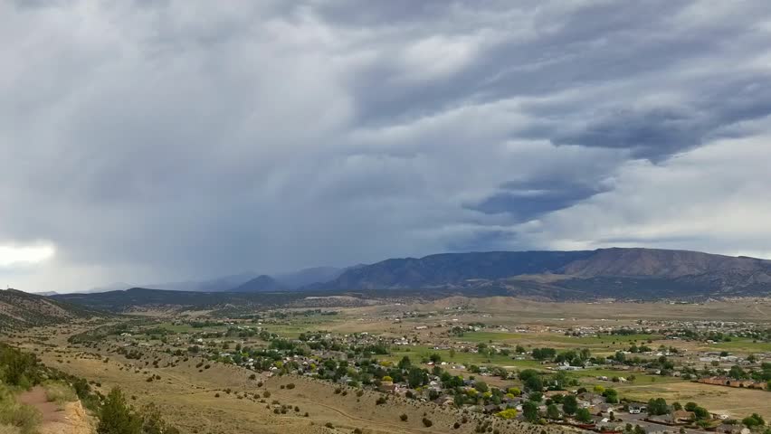 Storm clouds streaming over the Pikes Peak region near Canon City, Colorado, viewed from Skyline Drive on the hogback, creating a dramatic sky.