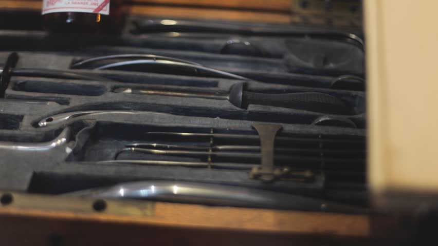 A collection of office tools and supplies arranged neatly on a wooden table, suitable for business or educational settings.