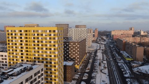 Drone Flying Forward above Modern City Buildings