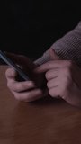 Businessman Checking Messages Carefully. Person Tapping Screen In Cozy Indoor Environment. Professional Examining Messages On Smartphone Amid Warm Indoor Lighting And Casual Attire - Powered by Shutterstock - Get 15% off with code: PIKWIZARD15