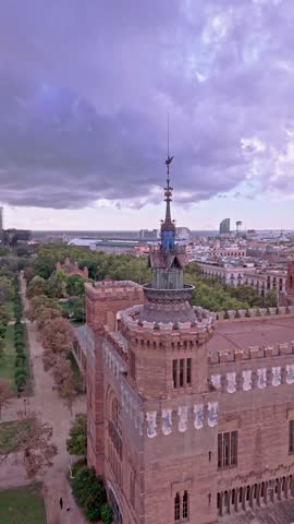 Aerial drone flying around castle of the three dragons in barcelona