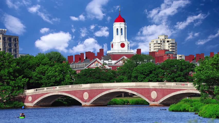 CAMBRIDGE, UNITED STATES  A beautiful view of the Charles River at Harvard University, Cambridge, with the John W  Weeks Bridge and Dunster House in the background John W. Weeks Bridge with clock tower over Charles River in Harvard University campus Boston 
