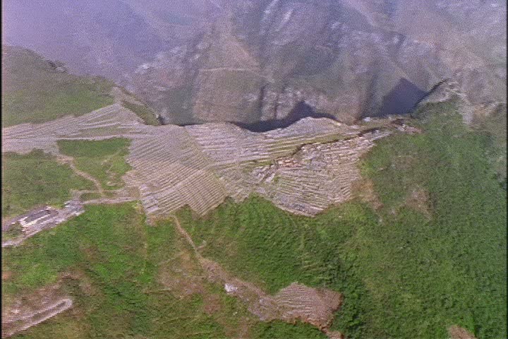 Aerial over Inca ruins of Machu Picchu in the Andes Mountains, Peru.