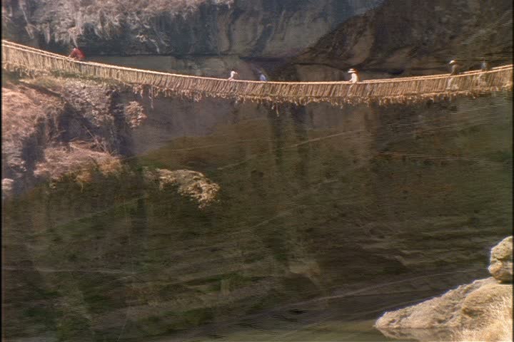 WS of rope suspension bridge over river gorge near Machu Picchu, Peru.