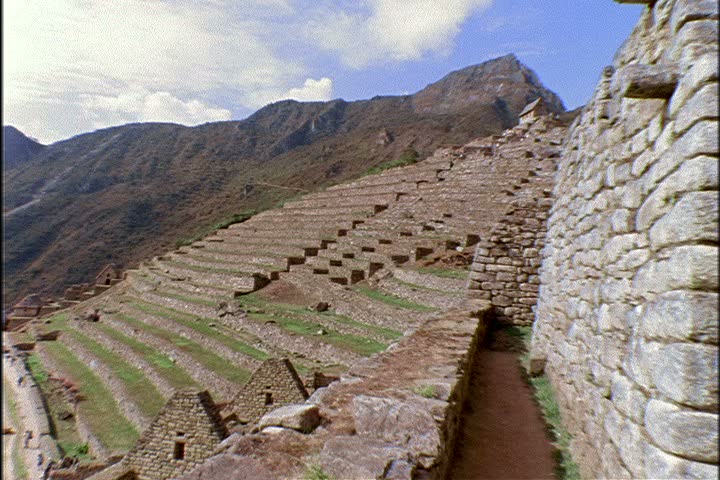 WS ruins at Machu Picchu in Peru, camera pans left.