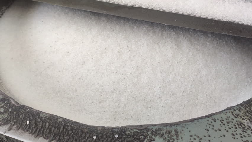 Polypropylene granules with additives are mixed in an industrial mixer. Plastic production raw materials polymer granules